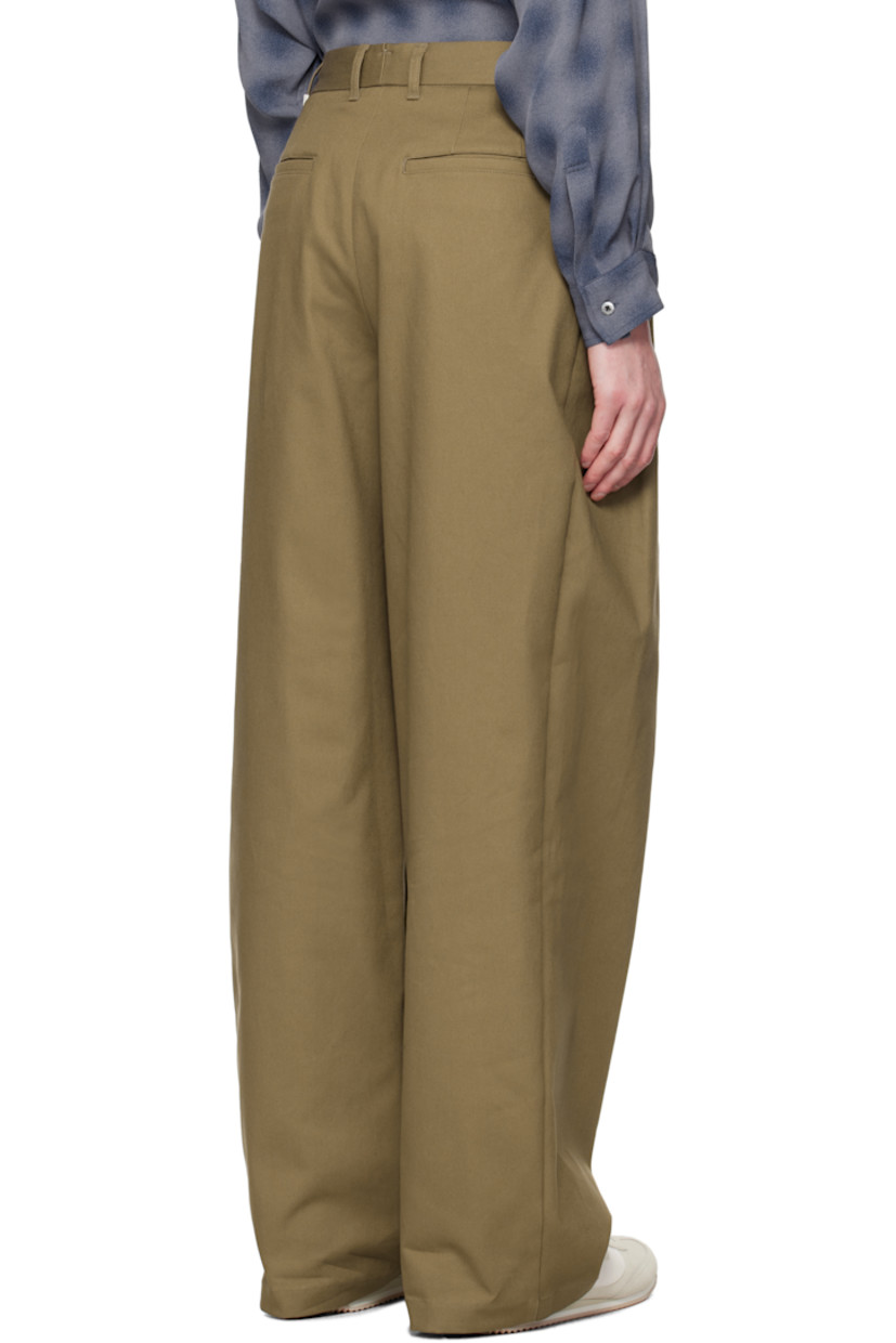 Wide-leg stretch cotton twill trousers.

· Belt loops
· Four-pocket styling
· Zip fly
· Pleats at front 
· Logo hardware at back waistband
· Partial plain-woven lining 

Available exclusively at SSENSE. 

Supplier color: Br
