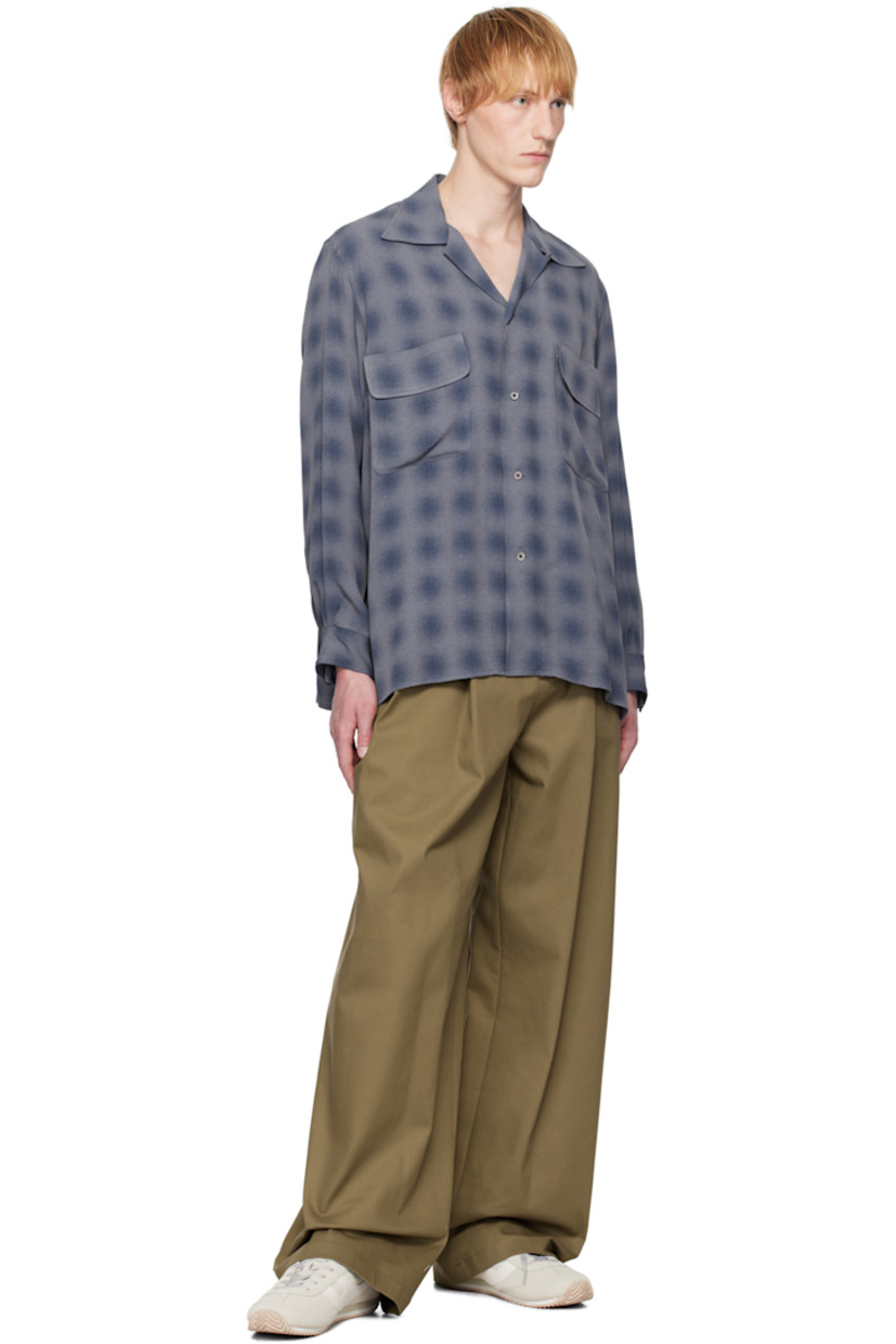 Wide-leg stretch cotton twill trousers.

· Belt loops
· Four-pocket styling
· Zip fly
· Pleats at front 
· Logo hardware at back waistband
· Partial plain-woven lining 

Available exclusively at SSENSE. 

Supplier color: Br