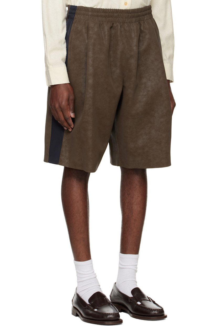 Faux-suede shorts. Subtle fading throughout.

· Elasticized waistband
· Three-pocket styling
· Pleats at front
· Contrast satin trim at outseams
· Full satin lining

Supplier color: Sepia brown