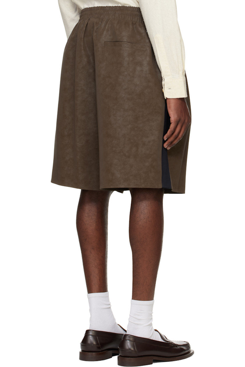 Faux-suede shorts. Subtle fading throughout.

· Elasticized waistband
· Three-pocket styling
· Pleats at front
· Contrast satin trim at outseams
· Full satin lining

Supplier color: Sepia brown