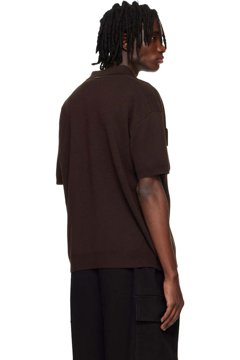 Knit wool-blend polo.

· Spread collar
· Four-button placket
· Bellows pockets at chest
· Rib-knit hem and cuffs
· Dropped shoulders
· Logo plaque at back collar 

Supplier color: Chocolate brown