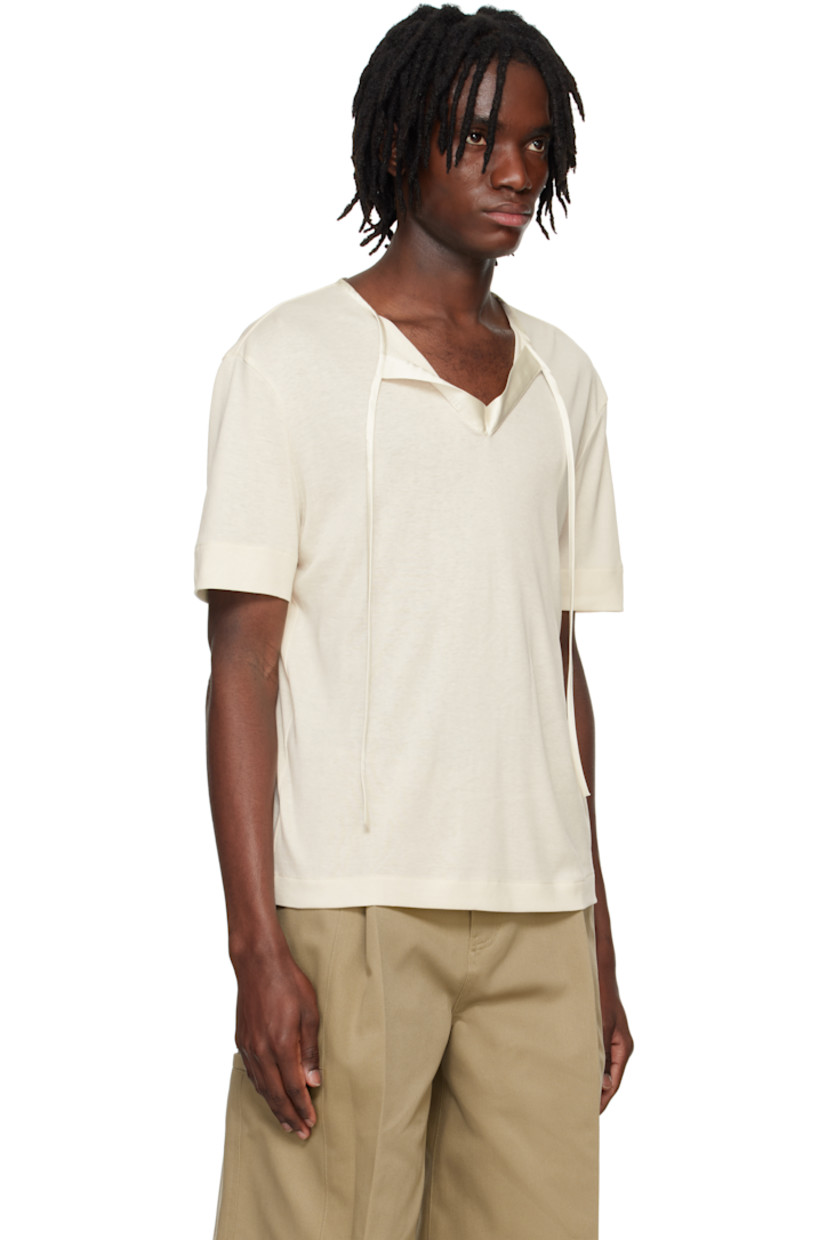 Rayon- and cotton-blend jersey T-shirt.

· Satin trim at crewneck
· Self-tie fastening at open placket
· Hardware at back collar

Supplier color: Ivory