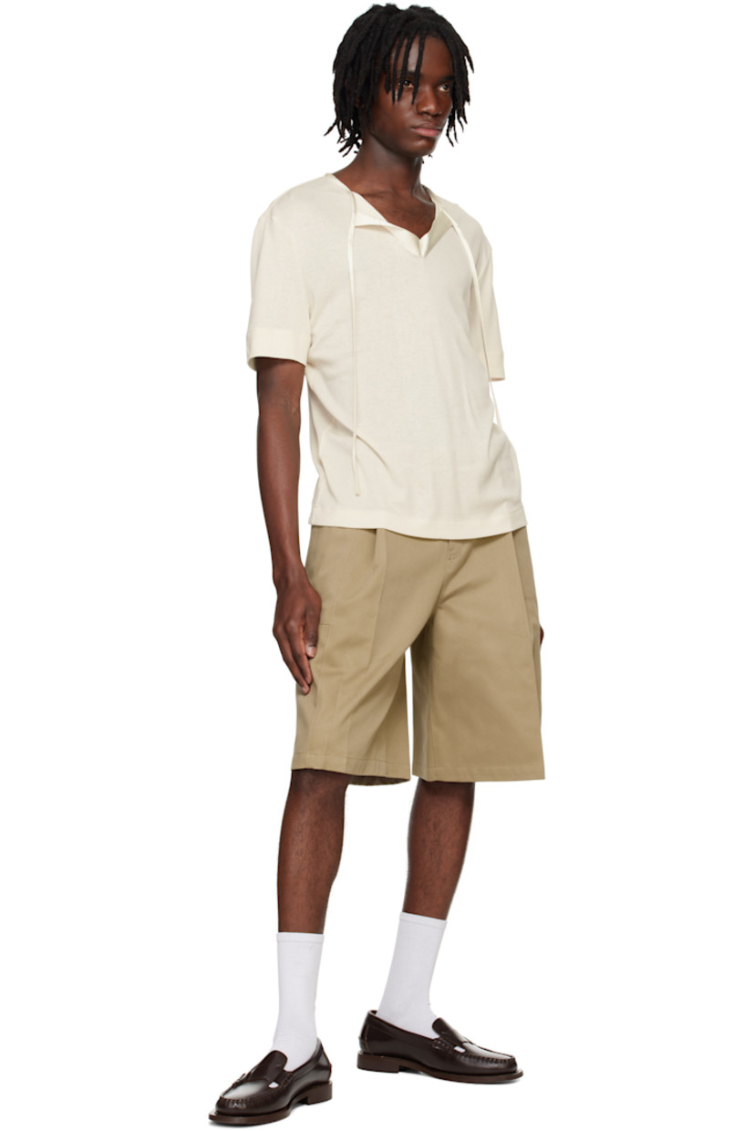 Rayon- and cotton-blend jersey T-shirt.

· Satin trim at crewneck
· Self-tie fastening at open placket
· Hardware at back collar

Supplier color: Ivory