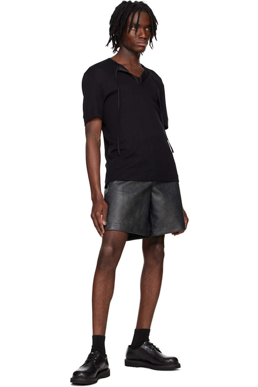 Rayon- and cotton-blend jersey T-shirt.

· Satin trim at crewneck
· Self-tie fastening at open placket
· Hardware at back collar

Supplier color: Black