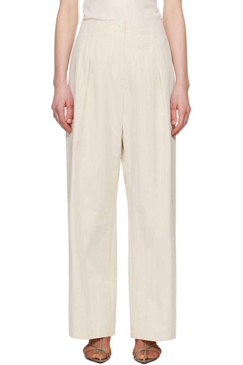 Cotton- and nylon-blend twill trousers. 

· Belt loops at partially elasticized waistband 
· Four-pocket styling
· Zip-fly
· Pleats at front
· Welt pocket at outseams
· Partial polyester taffeta lining

Supplier color: Ivory