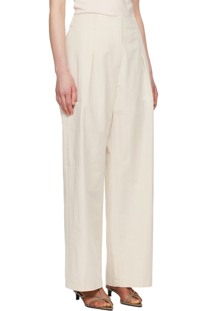 Cotton- and nylon-blend twill trousers. 

· Belt loops at partially elasticized waistband 
· Four-pocket styling
· Zip-fly
· Pleats at front
· Welt pocket at outseams
· Partial polyester taffeta lining

Supplier color: Ivory