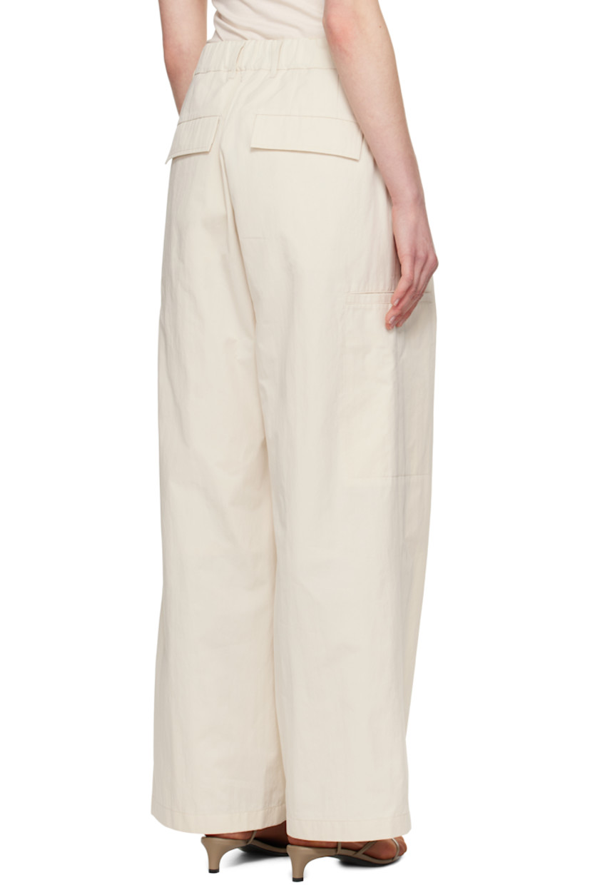 Cotton- and nylon-blend twill trousers. 

· Belt loops at partially elasticized waistband 
· Four-pocket styling
· Zip-fly
· Pleats at front
· Welt pocket at outseams
· Partial polyester taffeta lining

Supplier color: Ivory