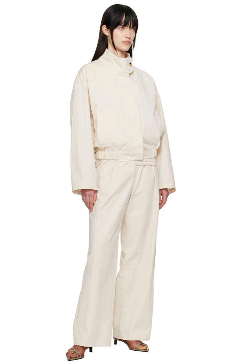 Cotton- and nylon-blend twill trousers. 

· Belt loops at partially elasticized waistband 
· Four-pocket styling
· Zip-fly
· Pleats at front
· Welt pocket at outseams
· Partial polyester taffeta lining

Supplier color: Ivory