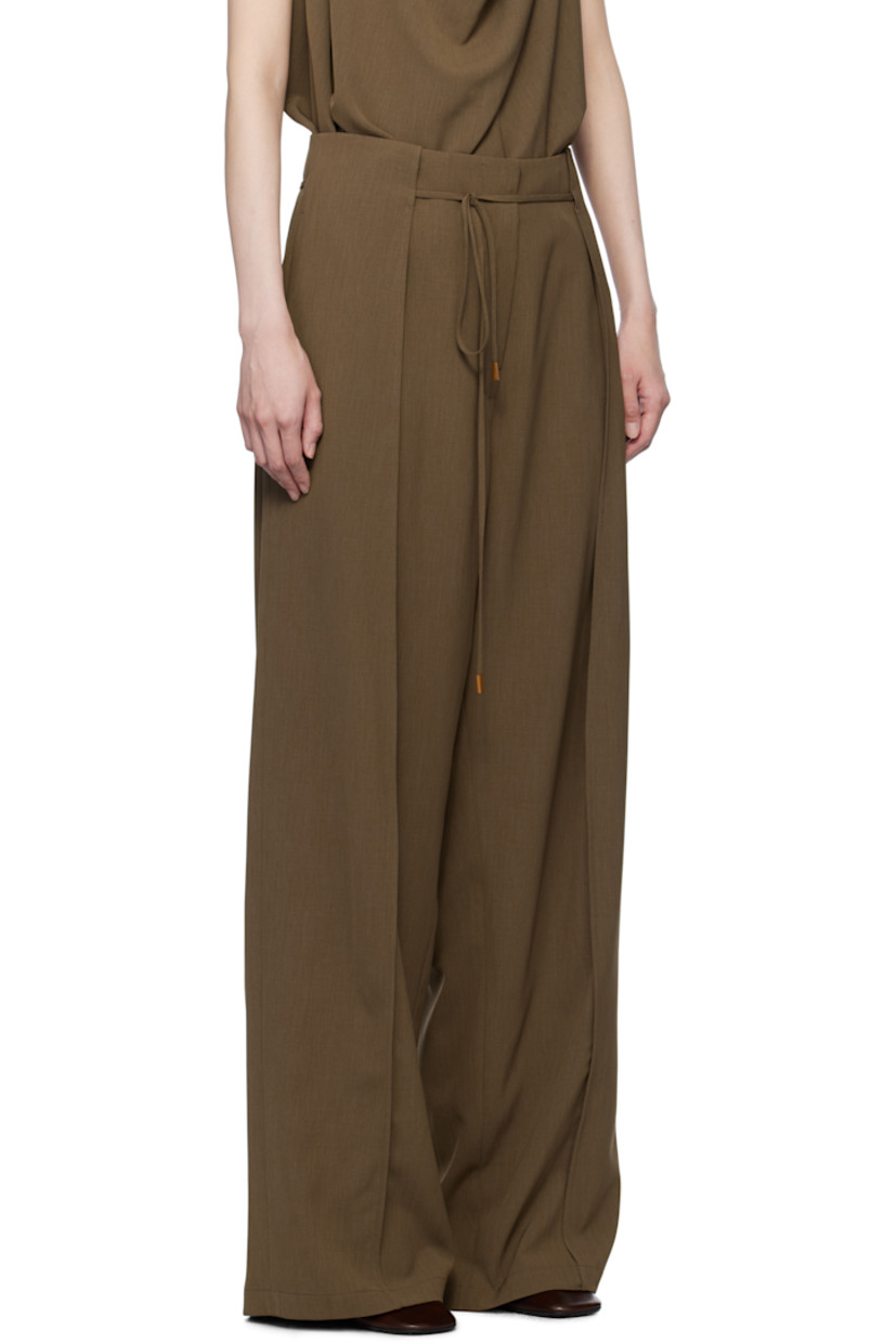 Stretch polyester twill trousers. 

· Removable self-tie drawstring at waistband
· Four-pocket styling
· Zip-fly
· Folded panel at front legs
· Full satin lining

Supplier color: Brown
