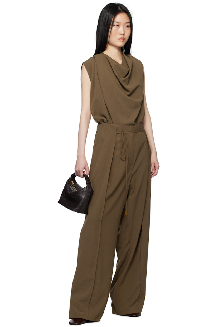 Stretch polyester twill trousers. 

· Removable self-tie drawstring at waistband
· Four-pocket styling
· Zip-fly
· Folded panel at front legs
· Full satin lining

Supplier color: Brown