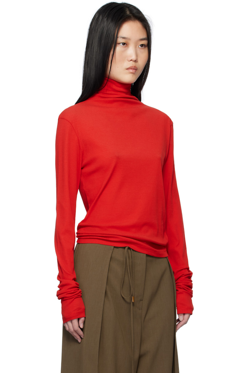 Semi-sheer cotton ribbed jersey turtleneck.

Supplier color: Red