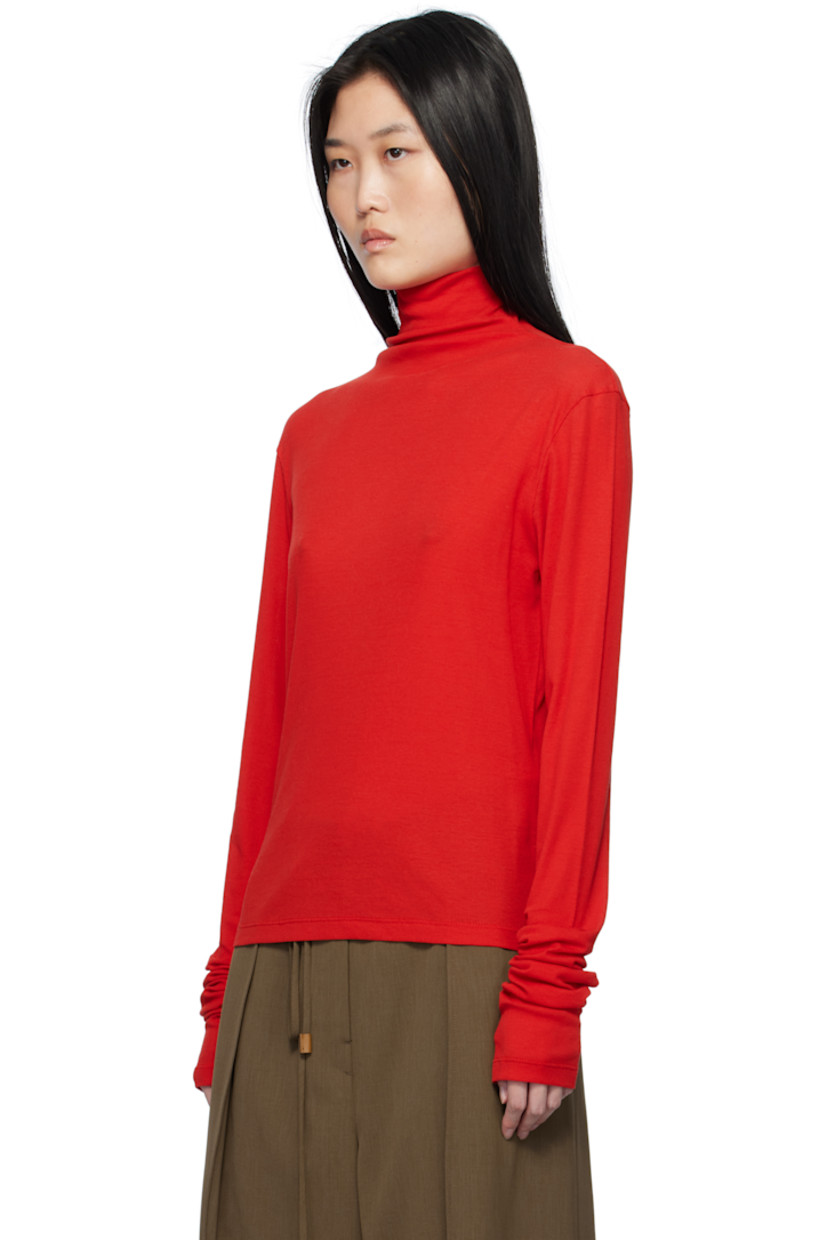 Semi-sheer cotton ribbed jersey turtleneck.

Supplier color: Red