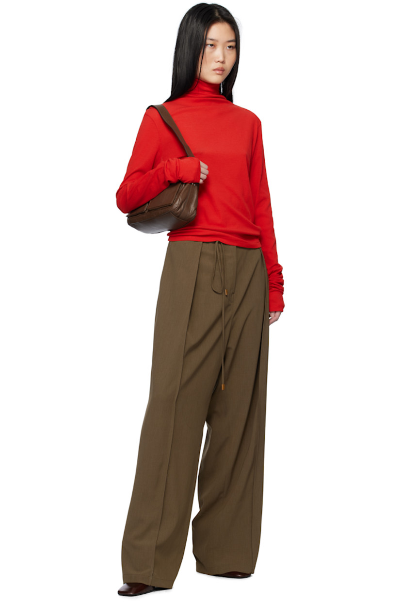 Semi-sheer cotton ribbed jersey turtleneck.

Supplier color: Red