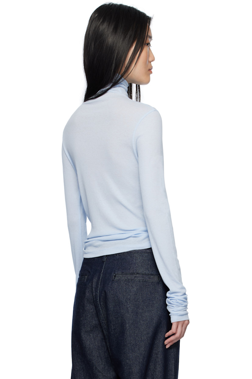 Semi-sheer cotton ribbed jersey turtleneck.

Supplier color: Blue