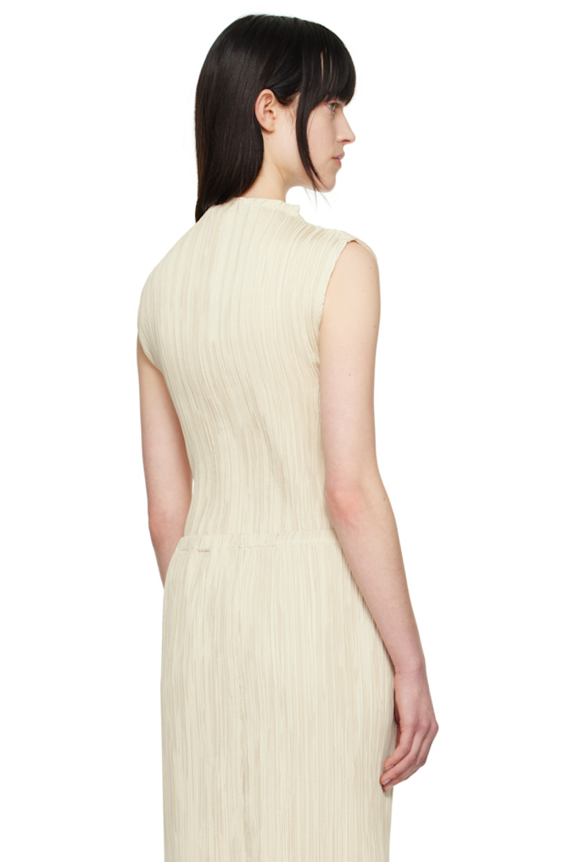 Garment-pleated polyester taffeta top. Mock neck.

Supplier color: Beige