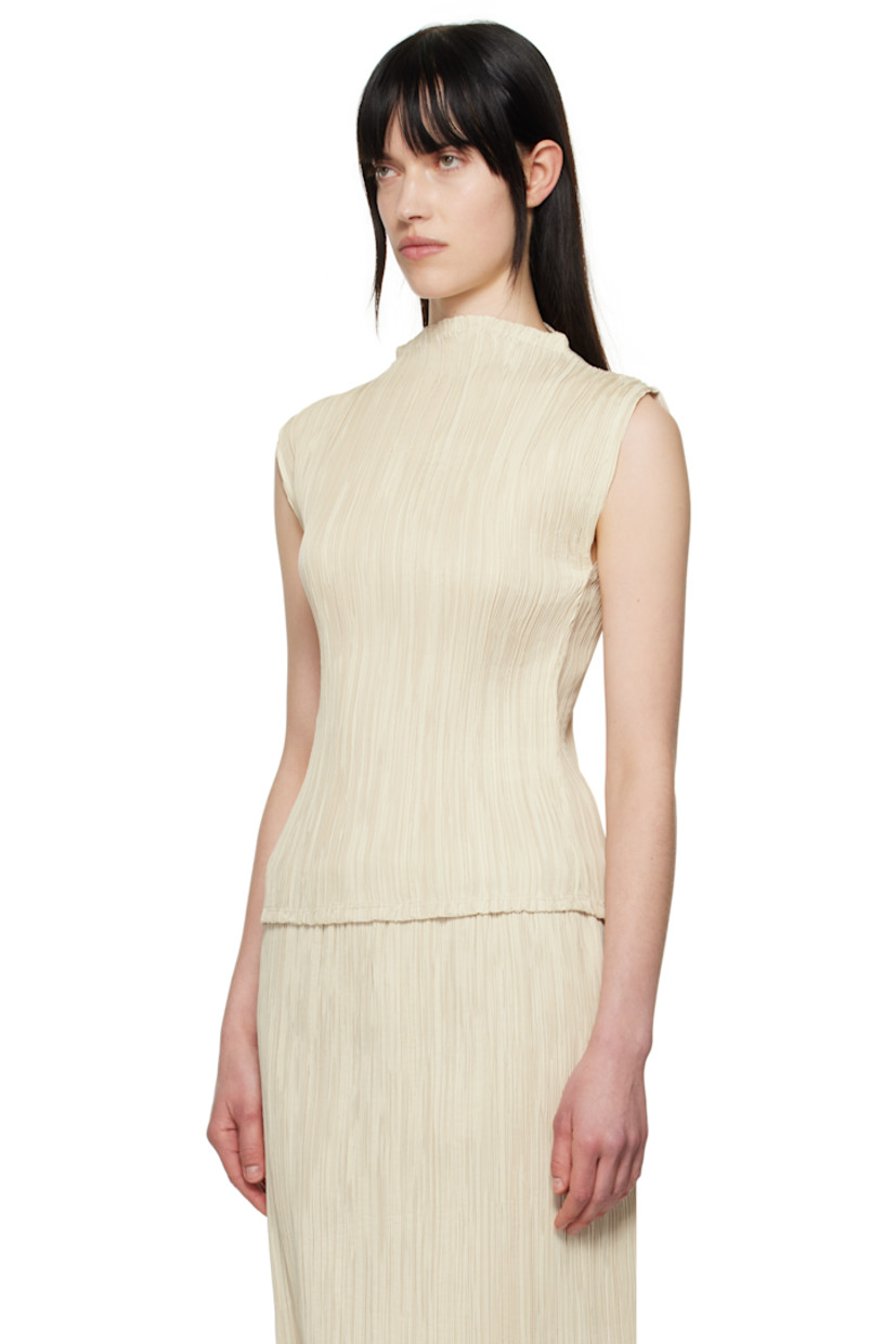 Garment-pleated polyester taffeta top. Mock neck.

Supplier color: Beige