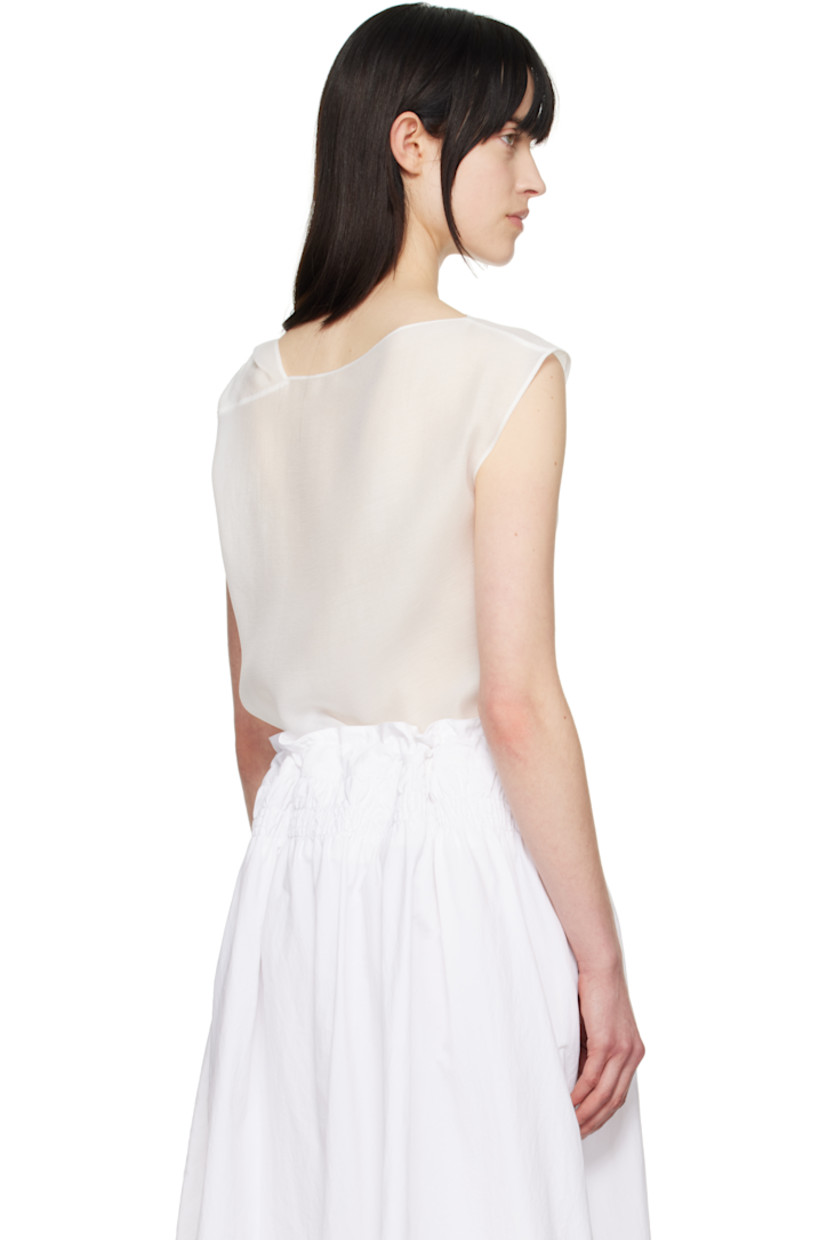 Semi-sheer crinkled tencel-blend crêpe tank top. Draping throughout.

· Boatneck
· Curved hem
· Twisted detailing at shoulder

Supplier color: White