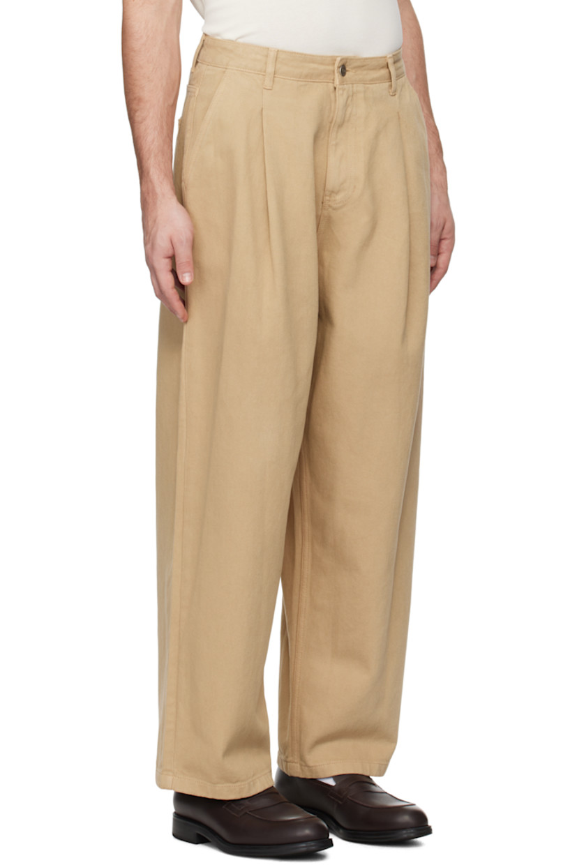 Wide-leg overdyed non-stretch denim jeans.

· Belt loops
· Four-pocket styling
· Zip-fly
· Pleats at front
· Logo patch at back waistband

Supplier color: Beige