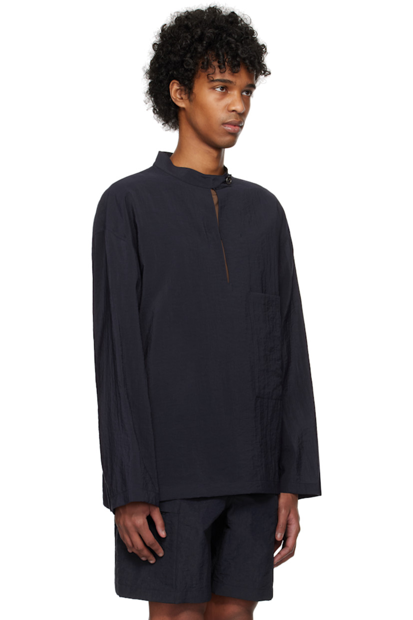 Crinkled plain-woven rayon-blend shirt. 

· Button tab at band collar
· Keyhole at chest
· Patch pocket
· Dropped shoulders
· Logo hardware at back collar
· Twin pleats at yoke

Supplier color: Navy