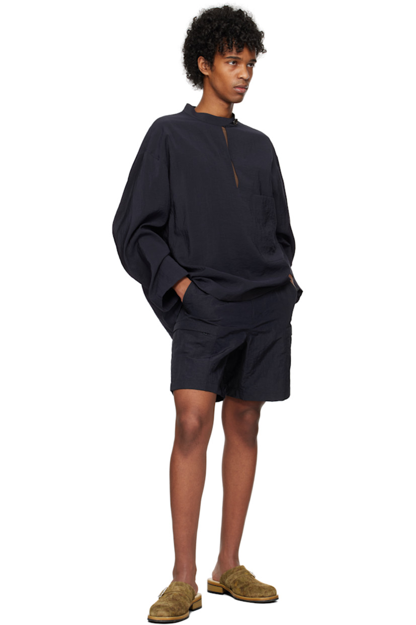 Crinkled plain-woven rayon-blend shirt. 

· Button tab at band collar
· Keyhole at chest
· Patch pocket
· Dropped shoulders
· Logo hardware at back collar
· Twin pleats at yoke

Supplier color: Navy