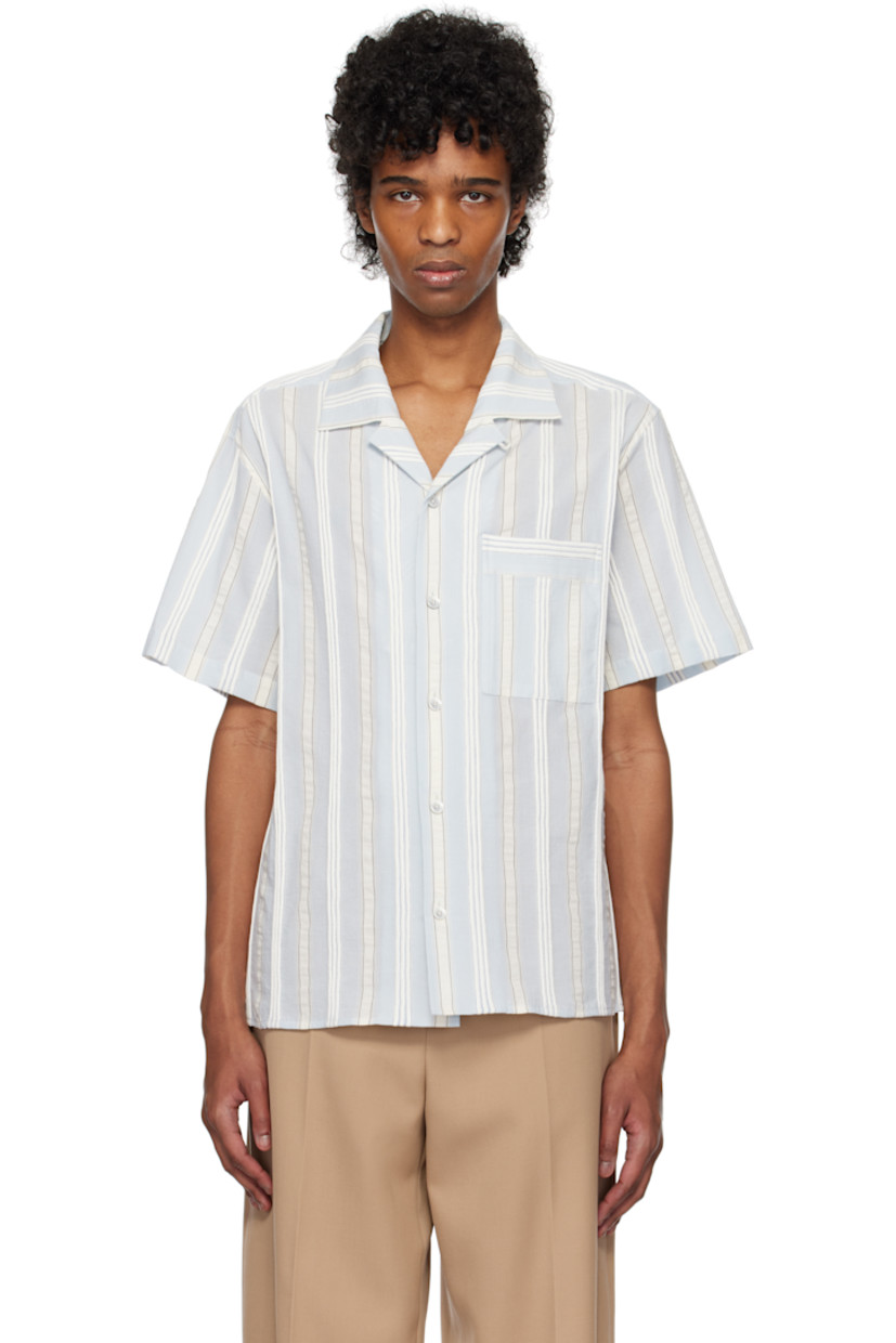 Cotton gauze shirt. Stripes printed and embroidered throughout.

· Button tab at open spread collar 
· Button closure
· Patch pocket
· Vented side seams
· Logo hardware at back collar
· Twin pleats at yoke 

Supplier color: Blue