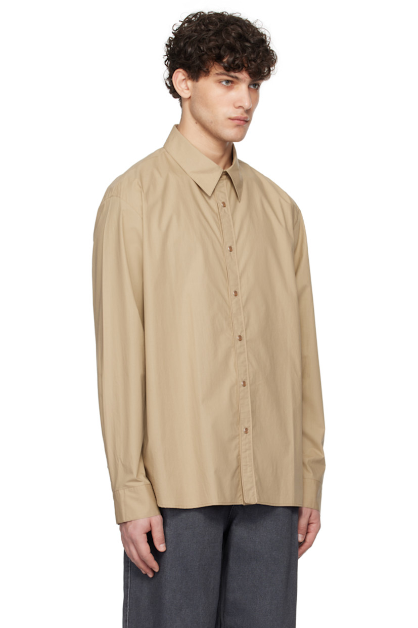 Cotton poplin shirt. 

· Spread collar
· Press-stud closure
· Shirttail hem
· Adjustable single-press-stud barrel cuffs
· Logo hardware at back collar
· Box pleat at back yoke

Supplier color: Beige