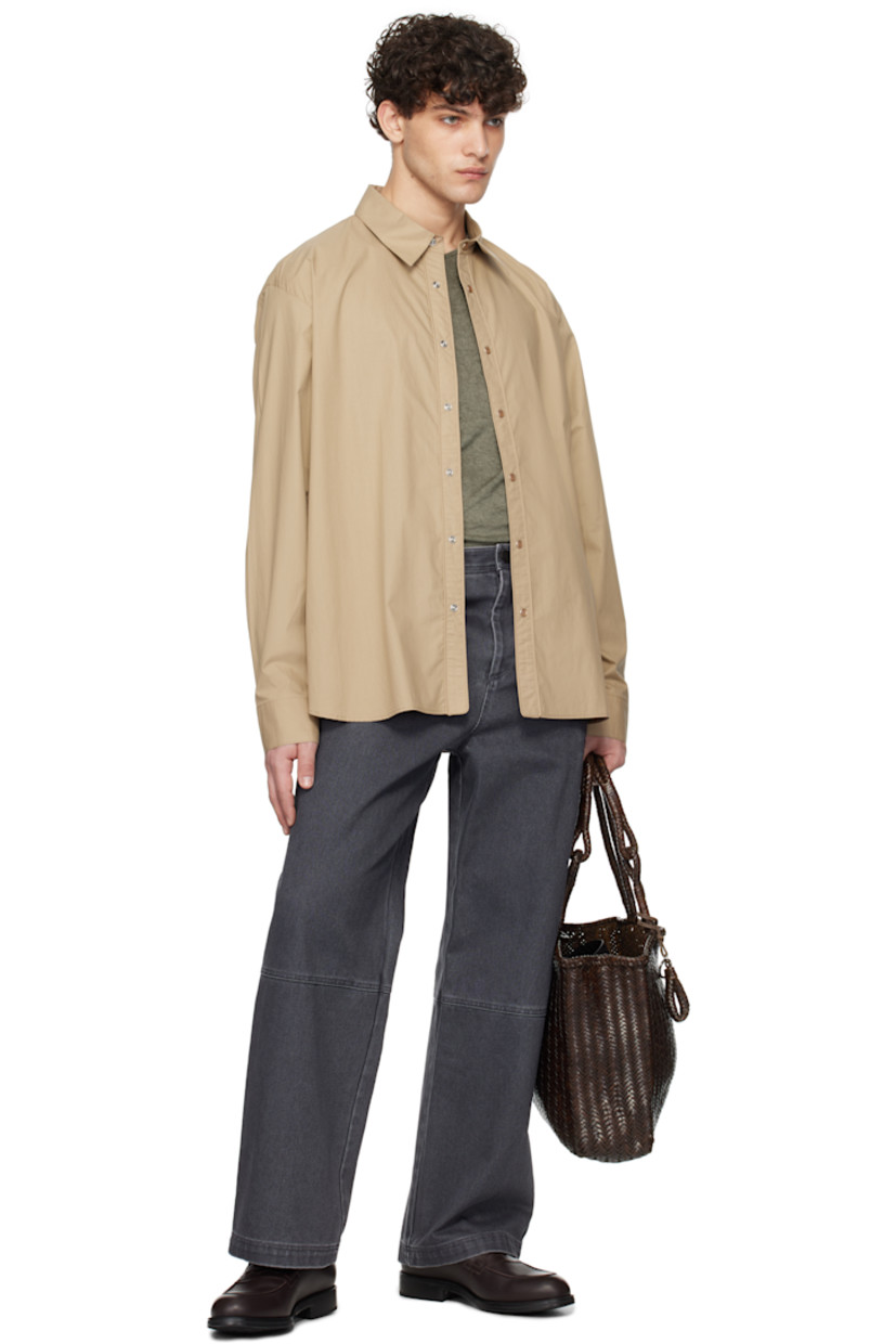 Cotton poplin shirt. 

· Spread collar
· Press-stud closure
· Shirttail hem
· Adjustable single-press-stud barrel cuffs
· Logo hardware at back collar
· Box pleat at back yoke

Supplier color: Beige