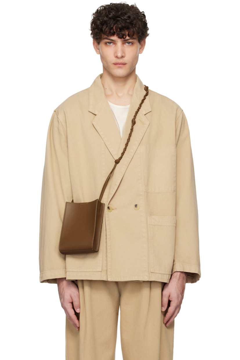 Overdyed non-stretch denim blazer.

· Notched lapel
· Double-breasted button closure
· Patch pockets
· Unlined

Supplier color: Beige