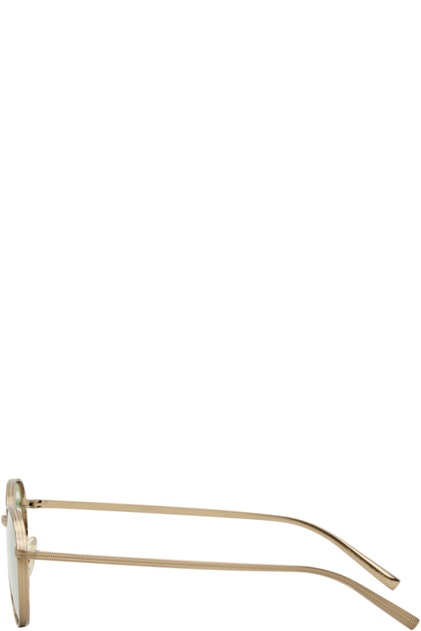 Handcrafted round titanium-frame sunglasses in gold tone.

· Engraved detailing throughout
· Green lenses
· Adjustable rubber nose pads
· Includes case
· Size: 49.20 145

Part of the 'Handmade in Japan' collection.

Supplier color: Brushed soft gold