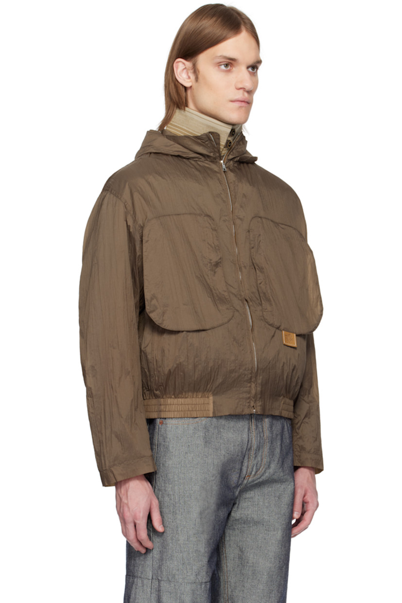 Lightweight crinkled nylon taffeta jacket. 

· Concealed drawstring at hood 
· Detachable inset rib-knit funnel neck
· Zip closure 
· Zip pockets 
· Leather logo flag at chest 
· Elasticized hem
· Inset rib-knit cuffs 

Supplier color: Monk's robe