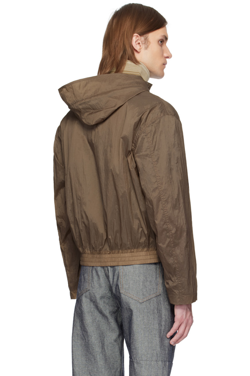 Lightweight crinkled nylon taffeta jacket. 

· Concealed drawstring at hood 
· Detachable inset rib-knit funnel neck
· Zip closure 
· Zip pockets 
· Leather logo flag at chest 
· Elasticized hem
· Inset rib-knit cuffs 

Supplier color: Monk's robe