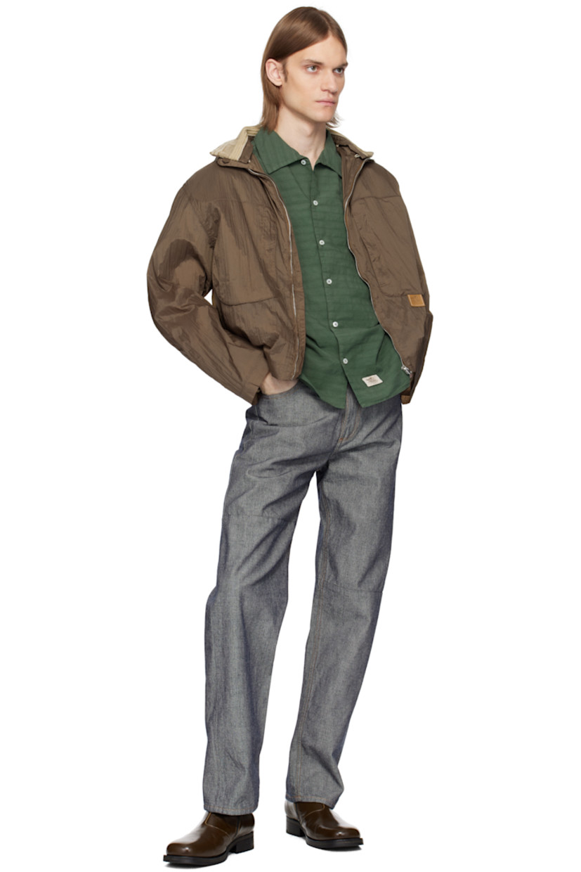 Lightweight crinkled nylon taffeta jacket. 

· Concealed drawstring at hood 
· Detachable inset rib-knit funnel neck
· Zip closure 
· Zip pockets 
· Leather logo flag at chest 
· Elasticized hem
· Inset rib-knit cuffs 

Supplier color: Monk's robe