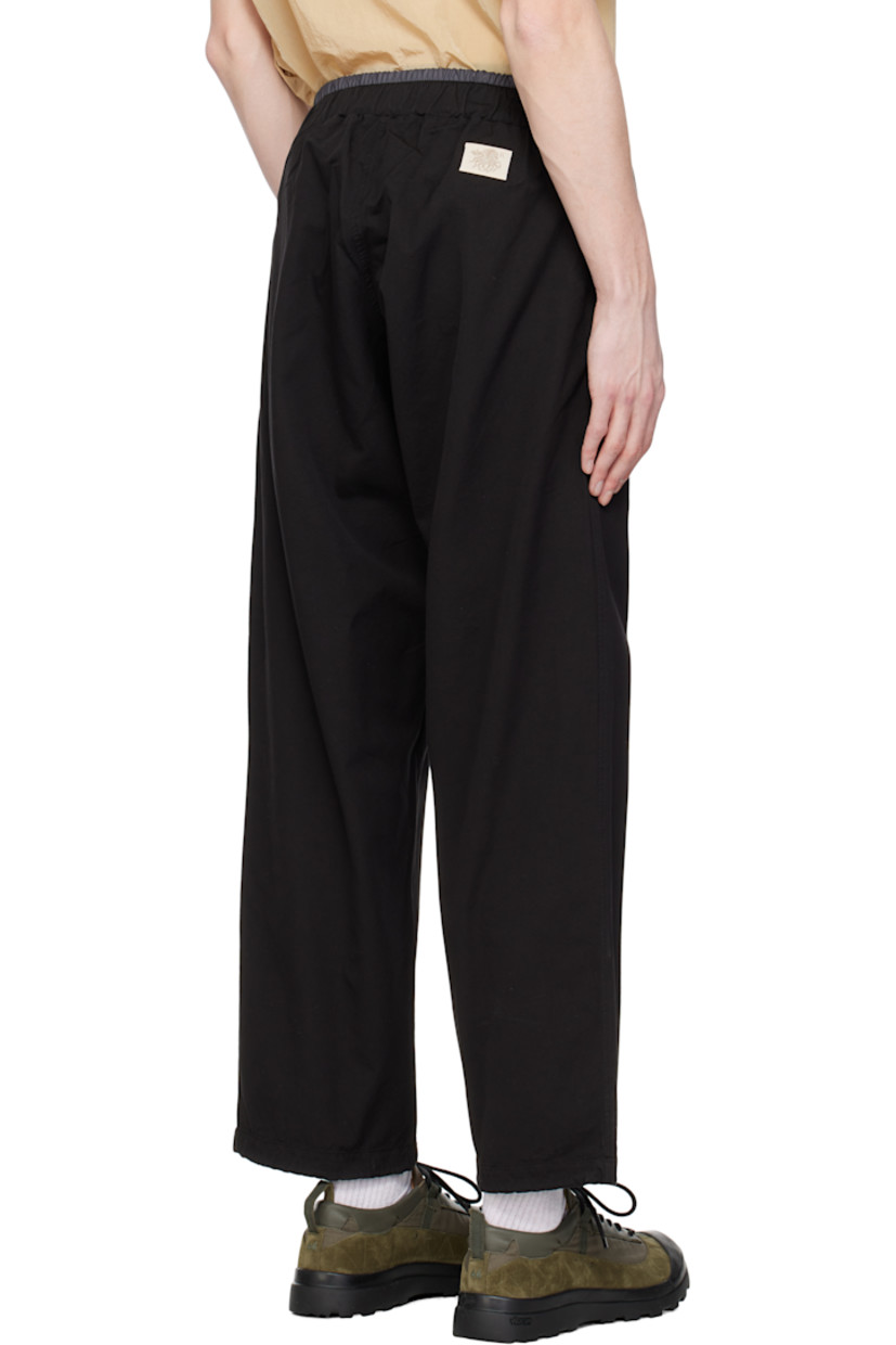 Cotton canvas track pants. 

· Elasticized waistband
· Two-pocket styling
· Concealed drawstring at cuffs
· Logo patch at back waistband 

Supplier color: Black