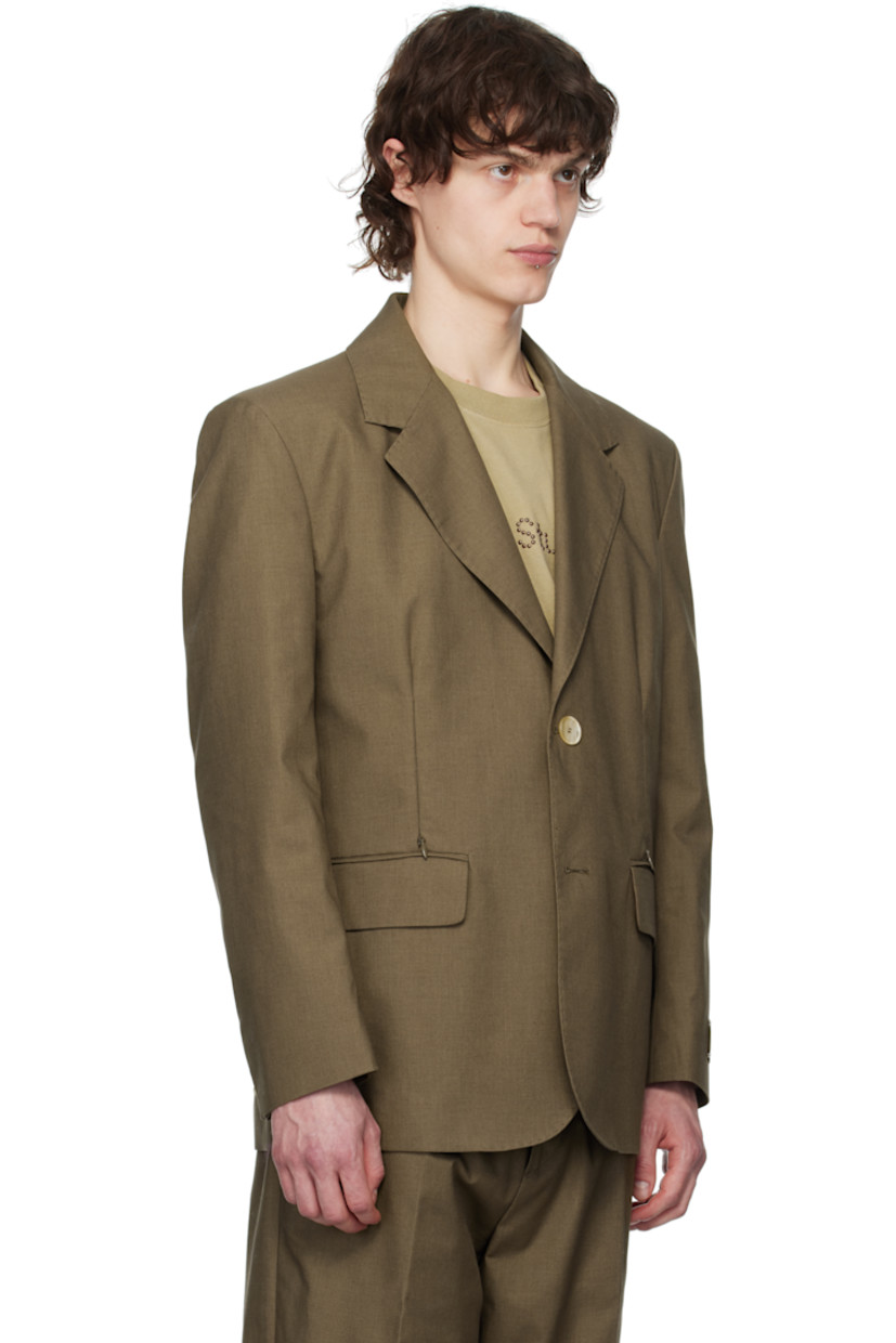 Polyester- and cotton-blend gabardine blazer. 

· Notched lapel
· Button closure
· Zip and flap pockets
· Padded shoulders
· Logo patch at cuff
· Button vent at cuffs
· Central vent at back hem
· Full satin lining

Supplier color: Martini olive