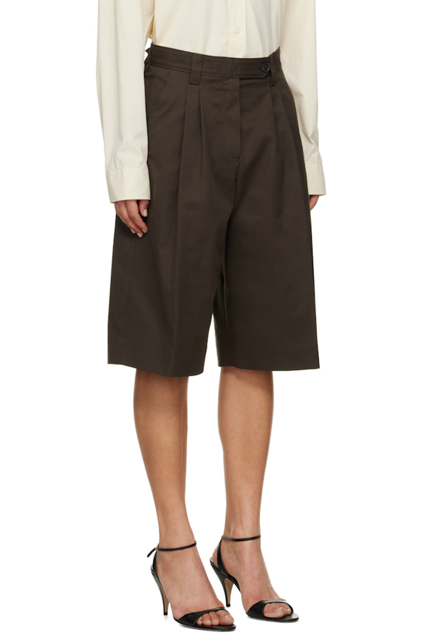 Wide-leg deadstock cotton twill shorts.

· Mid-rise
· Belt loops
· Four-pocket styling
· Zip fly
· Pleats at front
· Creased legs
· Darts at back waistband

Supplier color: Dark brown