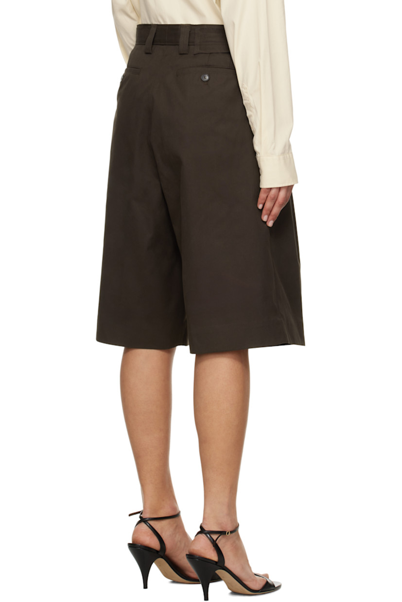 Wide-leg deadstock cotton twill shorts.

· Mid-rise
· Belt loops
· Four-pocket styling
· Zip fly
· Pleats at front
· Creased legs
· Darts at back waistband

Supplier color: Dark brown