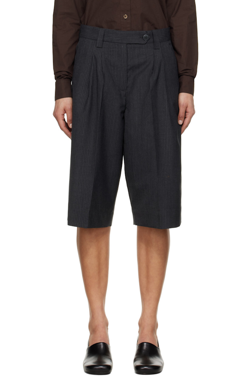 Wide-leg deadstock polyester- and virgin wool-blend twill shorts. Pinstripes throughout.

· Mid-rise
· Belt loops
· Four-pocket styling
· Zip fly
· Pleats at front
· Creased legs
· Darts at back waistband

Supplier color: Dark grey pinstripe