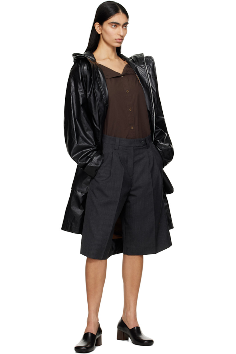 Wide-leg deadstock polyester- and virgin wool-blend twill shorts. Pinstripes throughout.

· Mid-rise
· Belt loops
· Four-pocket styling
· Zip fly
· Pleats at front
· Creased legs
· Darts at back waistband

Supplier color: Dark grey pinstripe