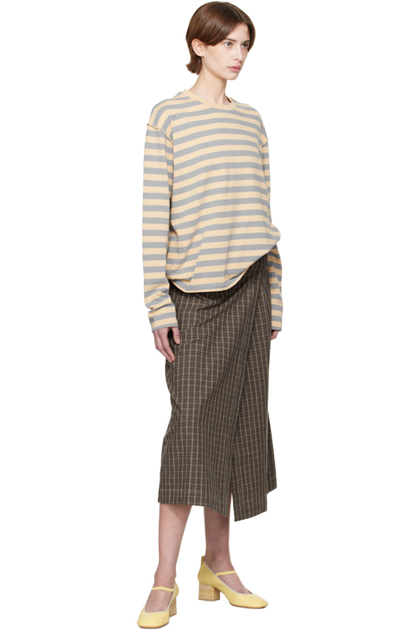 Garment-washed plain-woven cotton- and linen-blend midi skirt. Check pattern throughout. 

· Wrap construction
· Raw edge and button fastening at waistband
· Three-pocket styling

Supplier color: Brown linen check