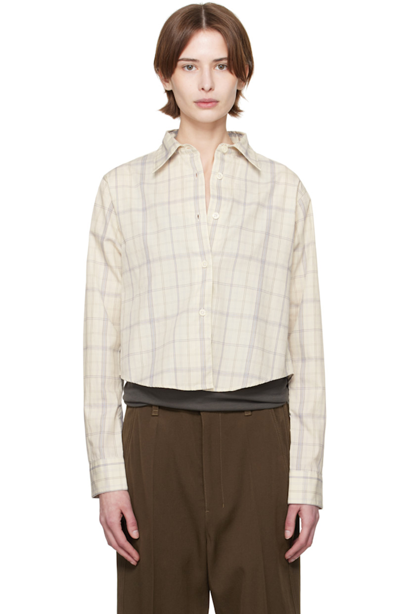 Lightweight deadstock cotton poplin shirt. Check pattern throughout. 

· Garment-washed
· Spread collar
· Button closure
· Cropped shirttail hem
· Single-button barrel cuffs

Supplier color: Ivory check