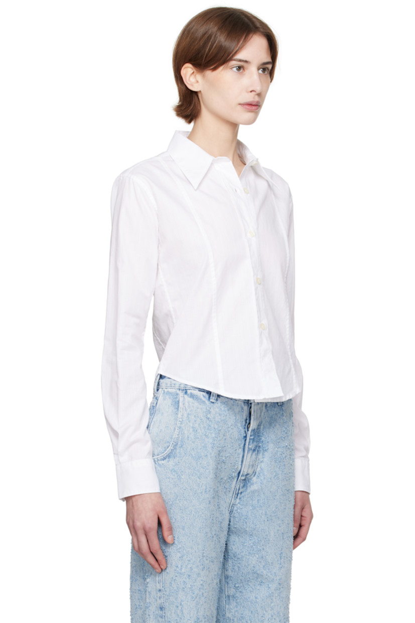 Lightweight cotton poplin shirt. Check pattern throughout. 

· Paneled construction  
· Spread collar
· Button closure
· Cropped shirttail hem
· Single-button barrel cuffs

Supplier color: Sheer check