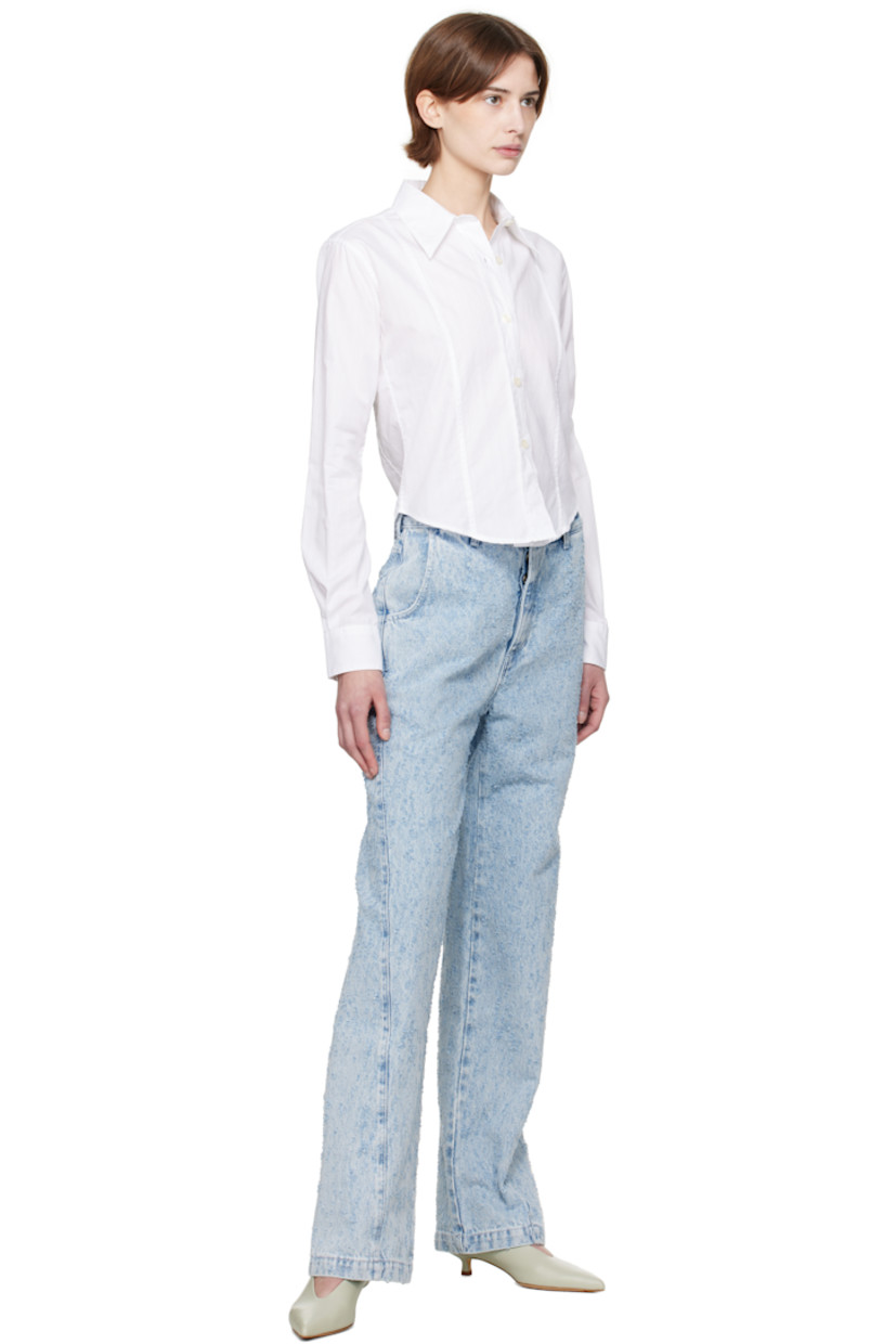 Lightweight cotton poplin shirt. Check pattern throughout. 

· Paneled construction  
· Spread collar
· Button closure
· Cropped shirttail hem
· Single-button barrel cuffs

Supplier color: Sheer check