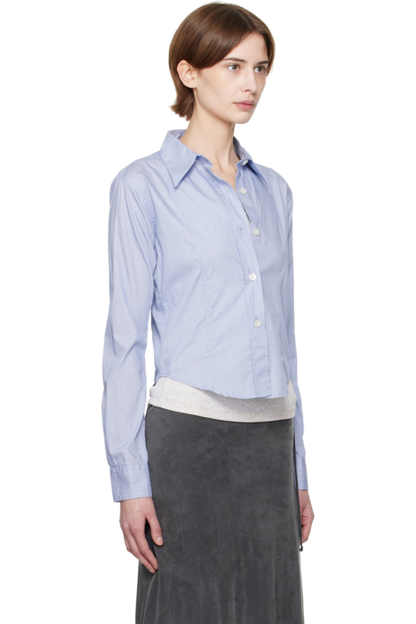 Lightweight deadstock cotton poplin shirt. Stripes throughout. 

· Garment-washed
· Paneled construction
· Spread collar
· Button closure
· Cropped shirttail hem
· Single-button barrel cuffs

Supplier color: Blue fine stripe