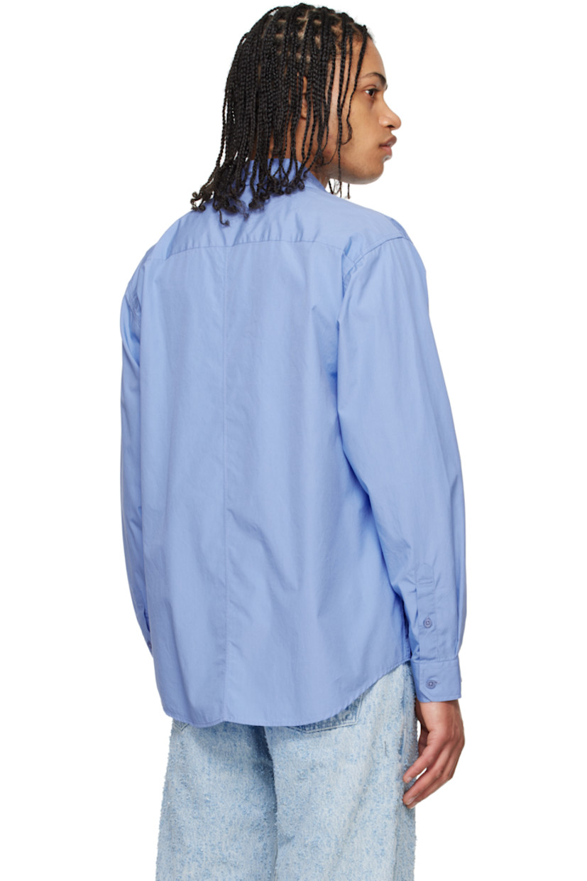 Garment-washed cotton poplin shirt. 

· Spread collar
· Button closure
· Shirttail hem
· Single-button barrel cuffs
· Locker loop at interior collar

Supplier color: Office blue