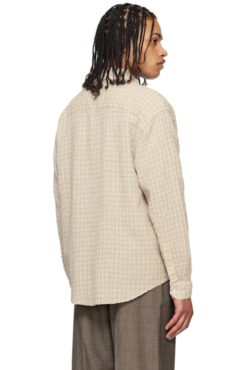 Cotton- and linen-blend seersucker shirt. Check pattern throughout.

· Spread collar
· Button closure
· Patch pocket at chest
· Shirttail hem
· Single-button barrel cuffs
· Box pleat at back yoke

Supplier color: Beige structure check