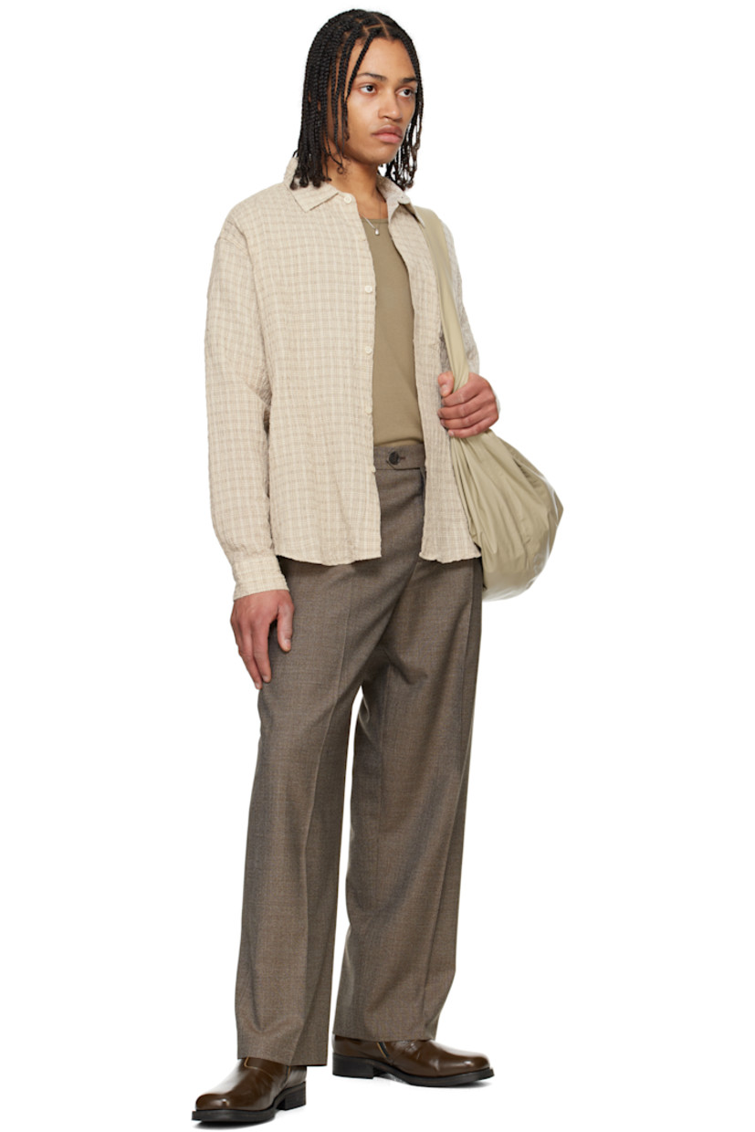 Cotton- and linen-blend seersucker shirt. Check pattern throughout.

· Spread collar
· Button closure
· Patch pocket at chest
· Shirttail hem
· Single-button barrel cuffs
· Box pleat at back yoke

Supplier color: Beige structure check