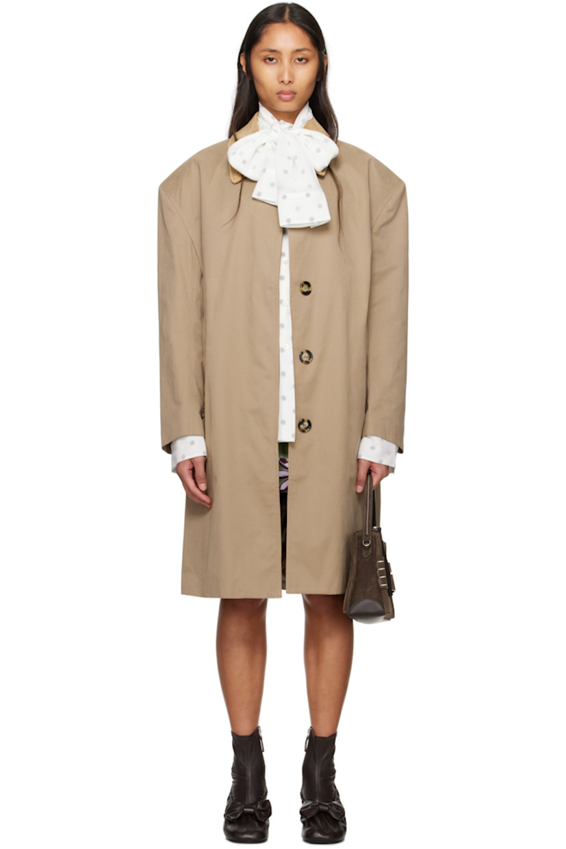 Polyester- and cotton-blend canvas coat.

· Corduroy spread collar
· Concealed button closure
· Welt pockets
· Padded shoulders
· Button tab at cuffs
· Central vent at back hem
· Patch pocket at interior
· Full satin lining

Supplier color: Sand