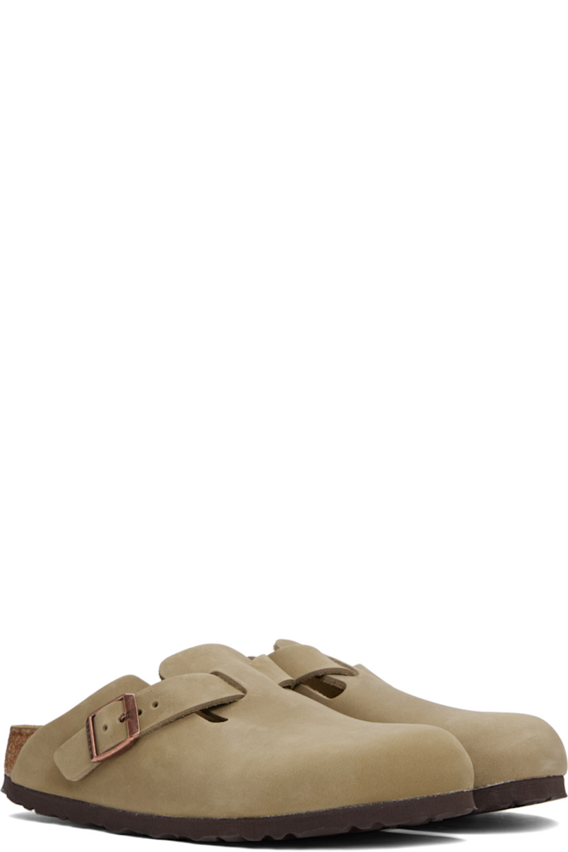 Oiled leather slip-on loafers in brown.

· Pin-buckle strap at vamp
· Logo embossed at inner side
· Logo printed at molded suede footbed
· Cork-latex midsole
· Treaded foam rubber sole
· Logo-engraved antiqued copper-tone hardware

Supplier color: Tobacco brown