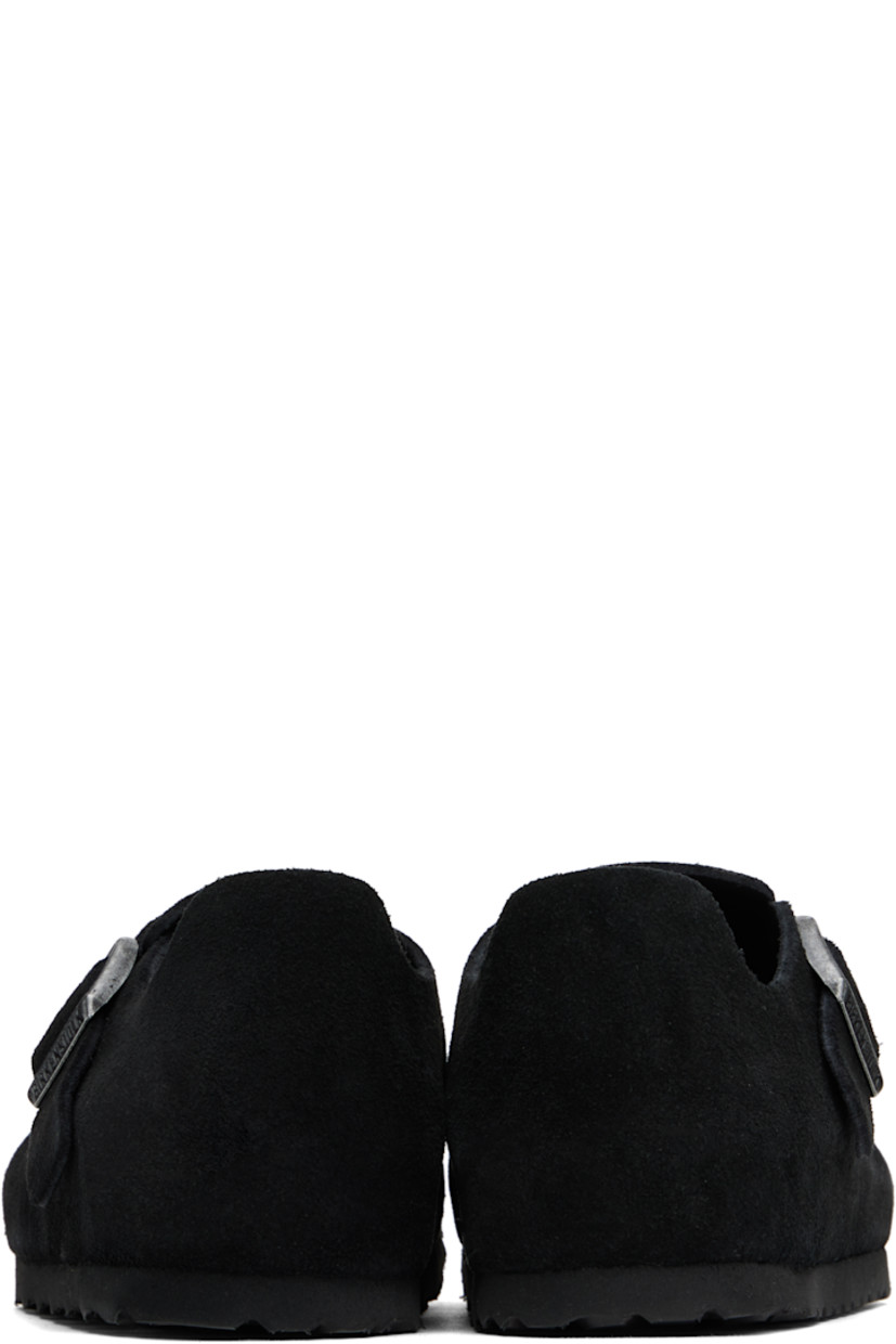 Suede loafers in black.

· Pin-buckle strap at vamp
· Logo embossed at inner side
· Suede lining
· Cork-latex midsole
· Treaded rubber sole
· Logo-engraved antiqued silver-tone hardware

Supplier color: Black suede