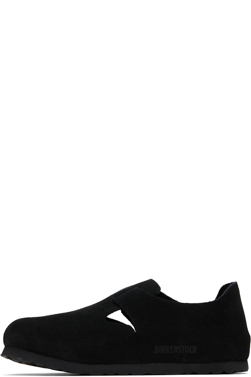 Suede loafers in black.

· Pin-buckle strap at vamp
· Logo embossed at inner side
· Suede lining
· Cork-latex midsole
· Treaded rubber sole
· Logo-engraved antiqued silver-tone hardware

Supplier color: Black suede